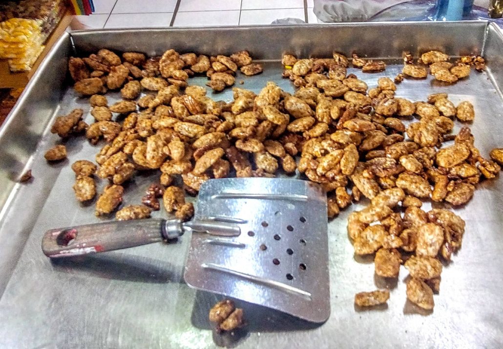 candied pecans cooling on a tray