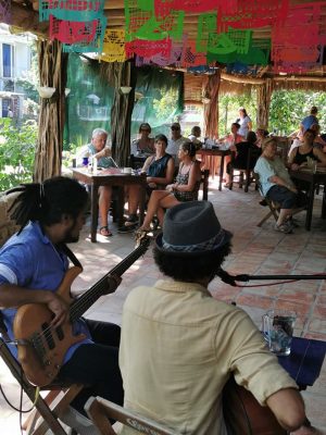 Two musicians play to the crowd inside the babel bar. 
