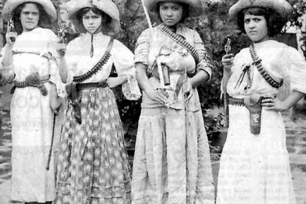 Mexican women from the Mexican Revolution carrying pistols in their hands.