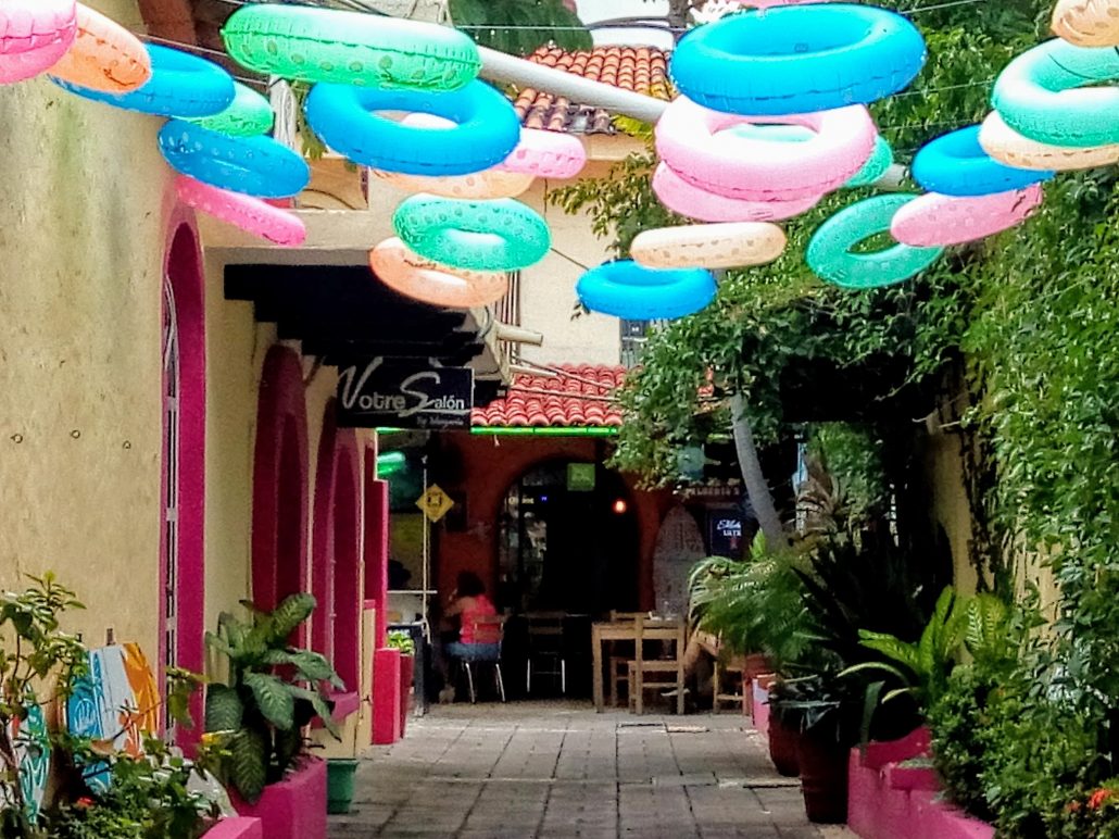 a colorful entrance to the twisted palms roof top lounge. 