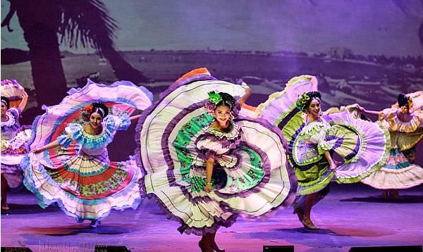 Women in colorful costumes performing a Mexican Folk Dance in Puerto Vallarta Mexico