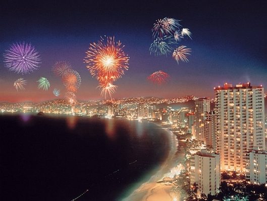 fireworks bursting along the coastline of puerto vallarta on new-year'seve