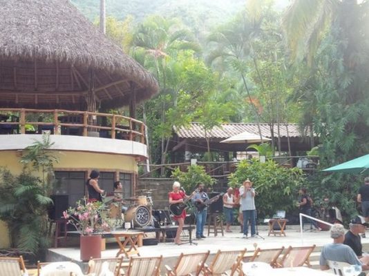 The garden setting and sound stage where musicians play at El Rio in Paso Ancho, Puerto Vallarta.