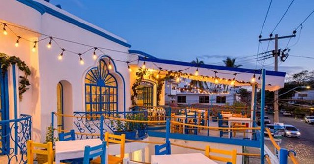 dining tables on a terrace in Mykonos Restaurant in Puerto Vallarta