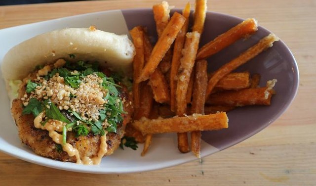 chicken bao with sweet potato fries on a plate