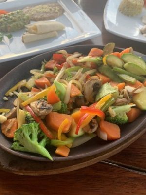 colorful slices vegetables in a skillet,