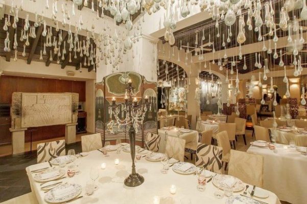 dining room with many glass drops dangling from the ceiling