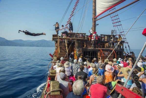 tourists enjoing a pirateship theater performance in Puerto Vallarta