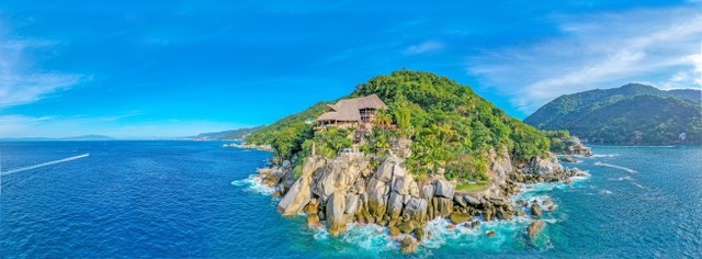 aerial view of Le Kliff restaurant perched on a rocky shoreline above the Pacific Ocean near Puerto Vallarta