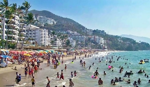 Crowds enjoy easter vacation on the beach in Puerto Vallarta